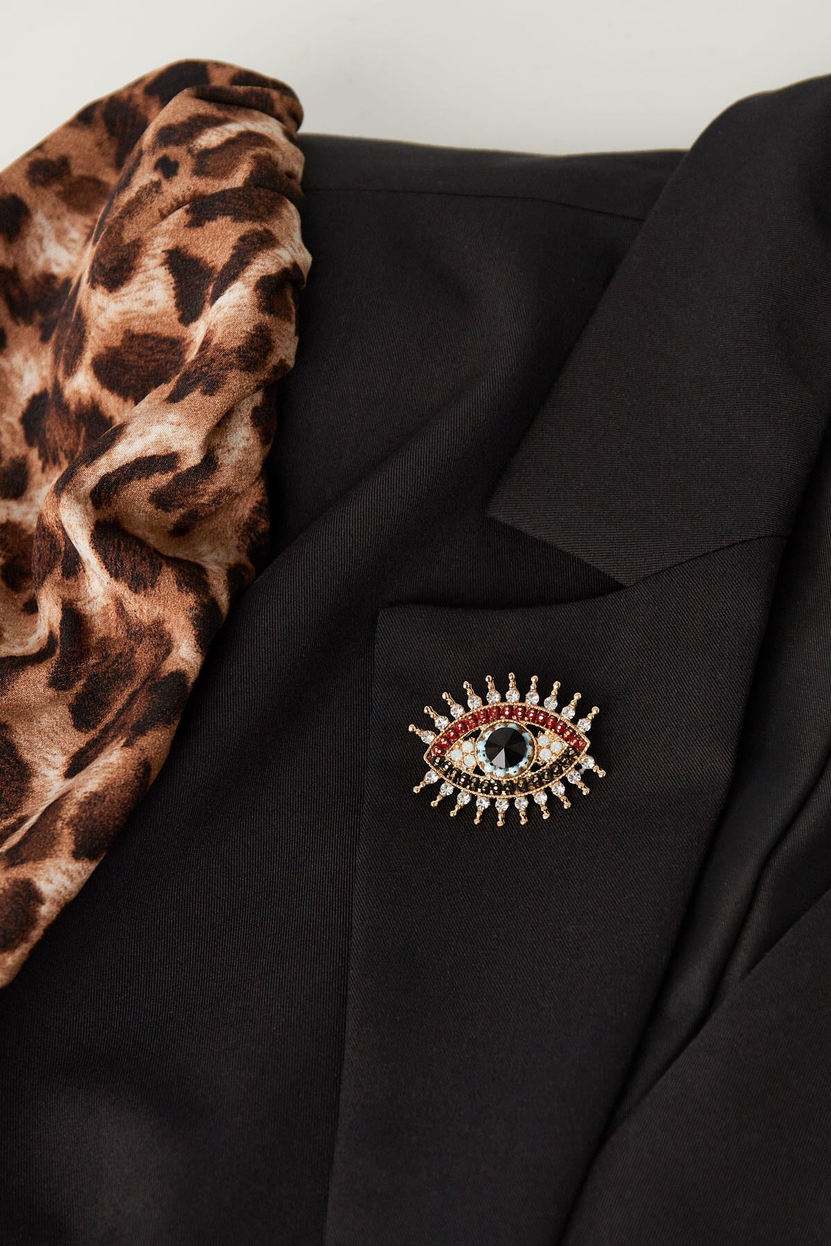 charming eye brooch