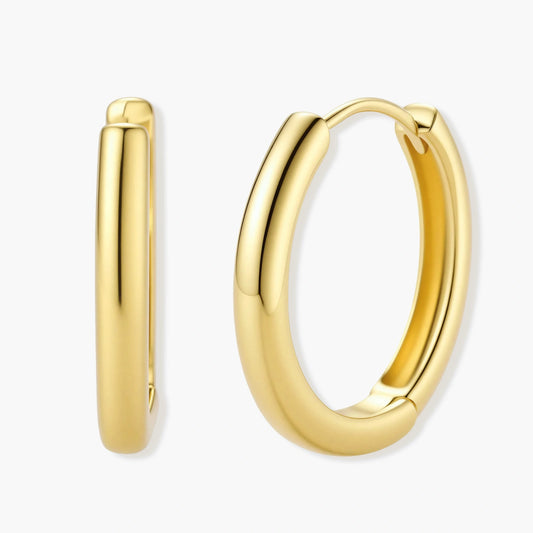 Rounded polished gold hoops showcasing a medium size and secure click closure, epitomising elegance and sophistication.