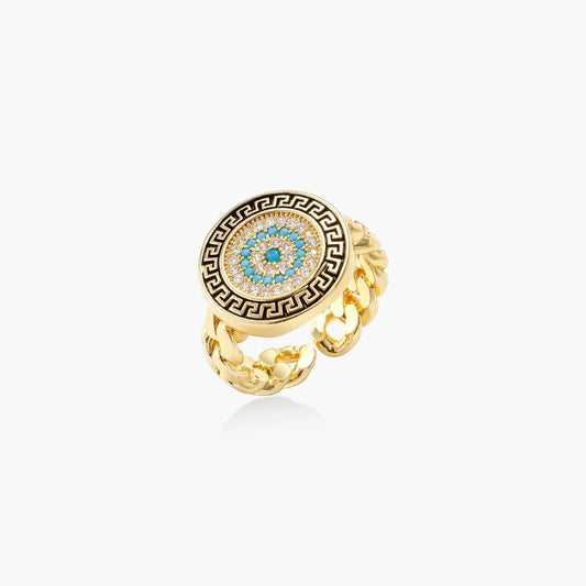 Gold chain ring featuring a turquoise centre with a Greek key border in black and gold, exuding elegance and charm.