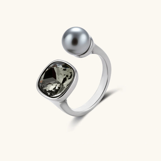 Modern adjustable ring featuring a cushion-shaped smoky zircon stone and a sleek metallic sphere in a platinum-plated finish.