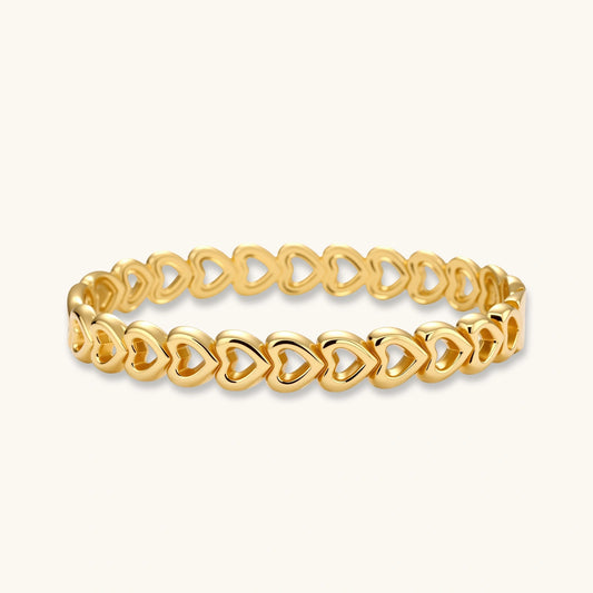 Gold bangle featuring elegantly linked open heart shapes with a polished finish, exuding sophistication and romance.