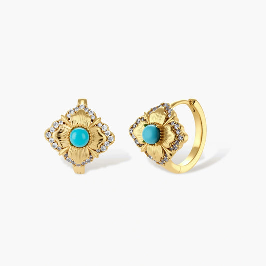 Close-up of 18K gold plated hoop earrings with turquoise center stones and zircon crystals in quatrefoil flower design