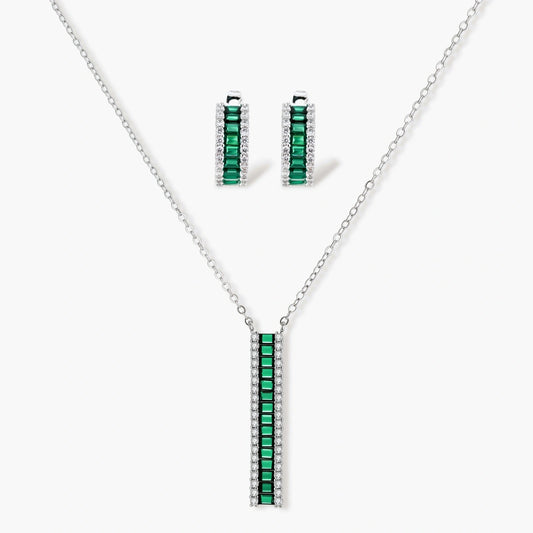 Elegant jewellery set featuring a necklace with green baguette elements and matching huggie earrings in a refined silver tone.