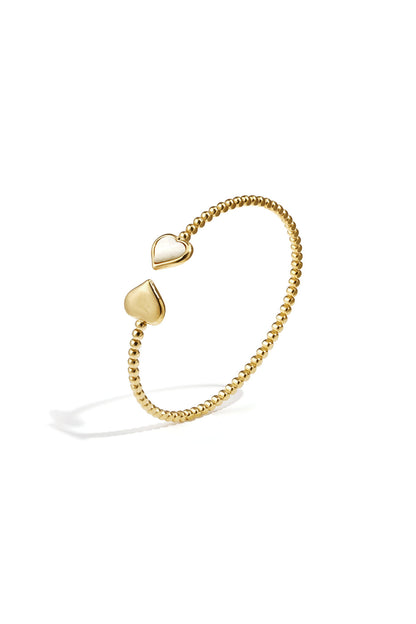 Symmetrically dotted bangle with detailed ends