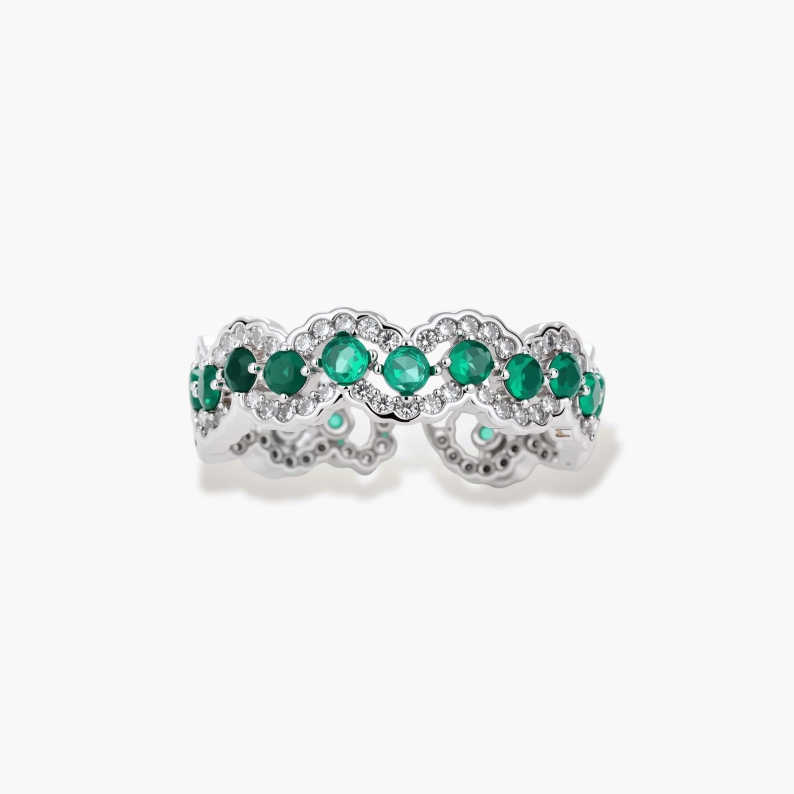 Platinum-plated copper ring with green zirconia stones in decorative scalloped wave pattern, adjustable band design.