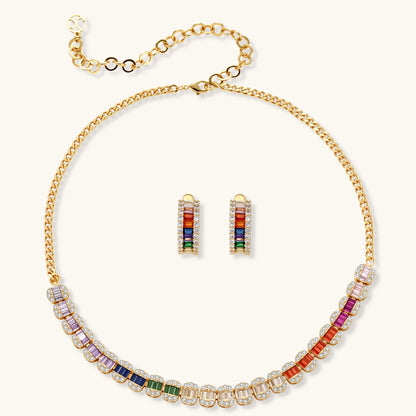 Gold-plated jewelry set featuring rainbow baguette-cut cubic zirconia stones in geometric design on cream background