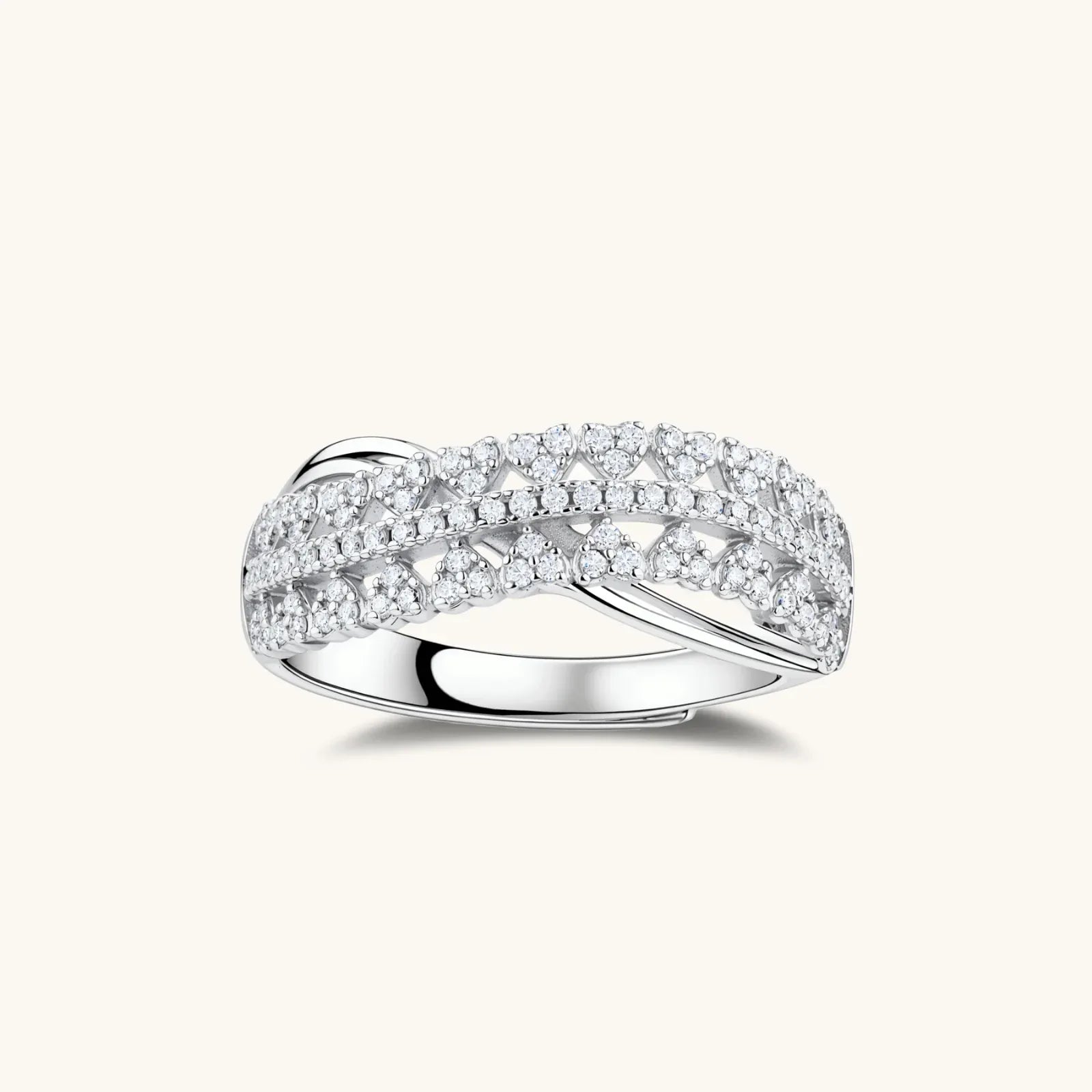 Sterling silver crossover ring with pavé-set moissanite stones creating an elegant infinity design on neutral background
