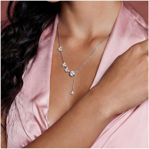 Sterling silver lariat necklace adorned with three delicate butterfly charms and a stunning drop pendant.
