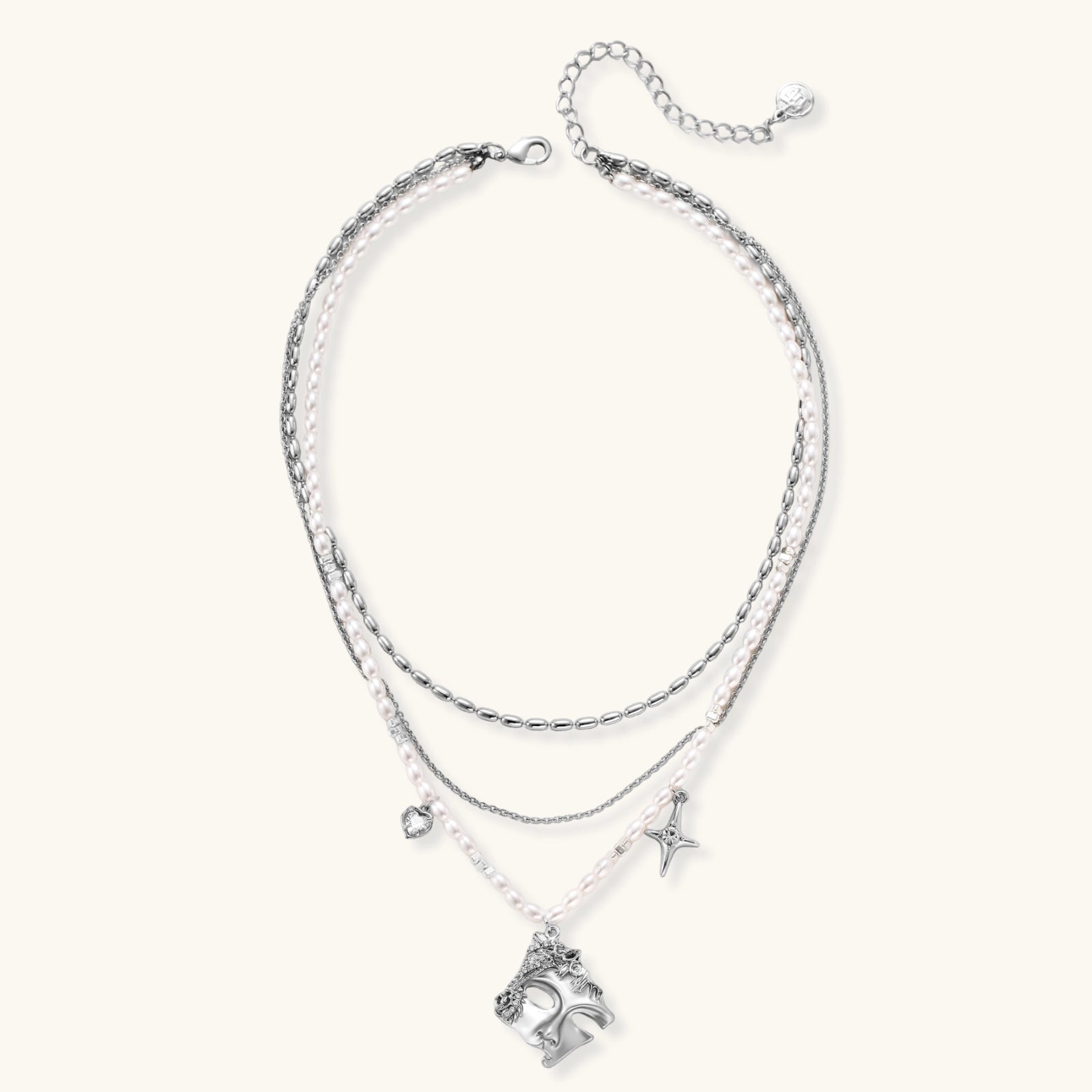 Multi-strand layered necklace set with silver chains, white pearls, star charm, heart pendant, and ornate decorative piece