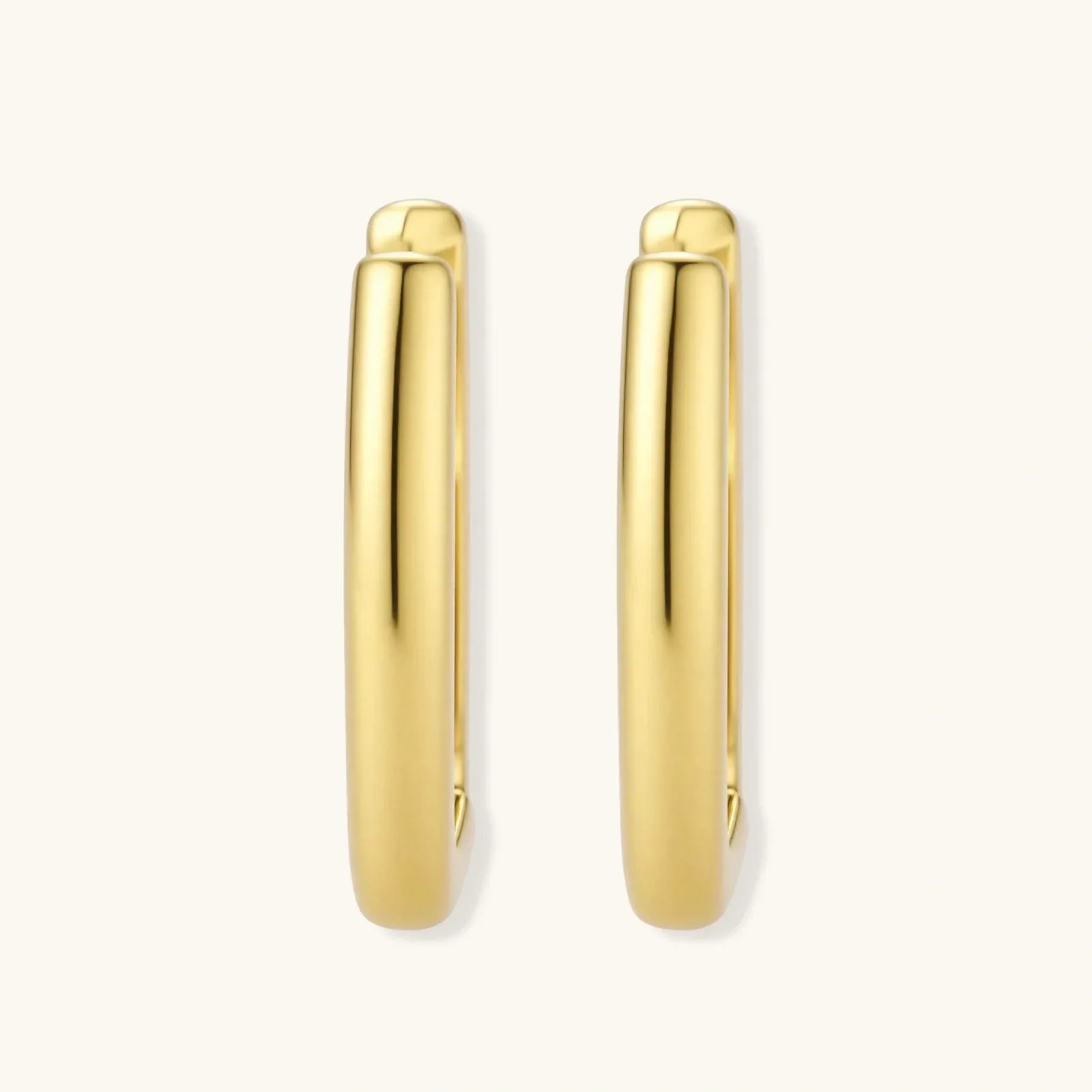 Polished gold-plated sterling silver hoop earrings with hinged closure mechanism on white background.
