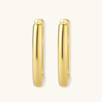 Polished gold-plated sterling silver hoop earrings with hinged closure mechanism on white background.