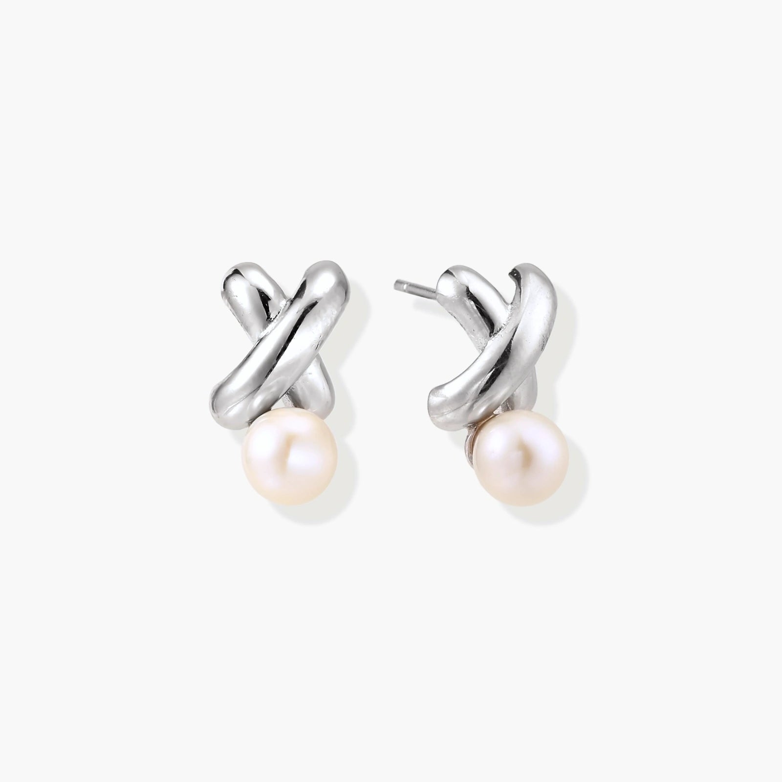 Twisted silver stud earrings featuring a polished design with a round freshwater pearl drop.