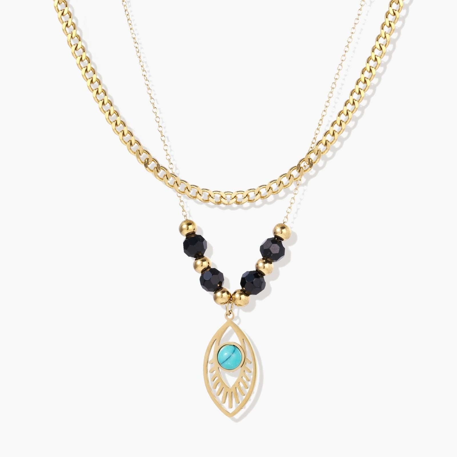 Layered gold necklace featuring a bold curb chain, delicate strand with black quartz beads, and a turquoise eye pendant.