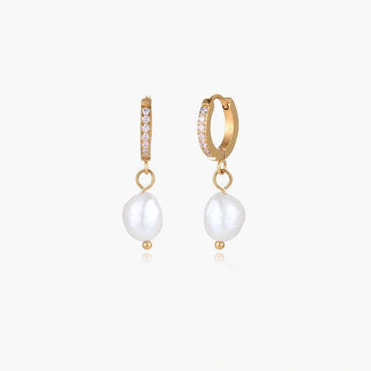 Gold huggie hoop earrings featuring unique baroque freshwater pearls and a sparkling pavé front.
