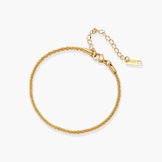Delicate 18K gold-plated stainless steel bracelet with a textured chain and adjustable extender for a perfect fit.