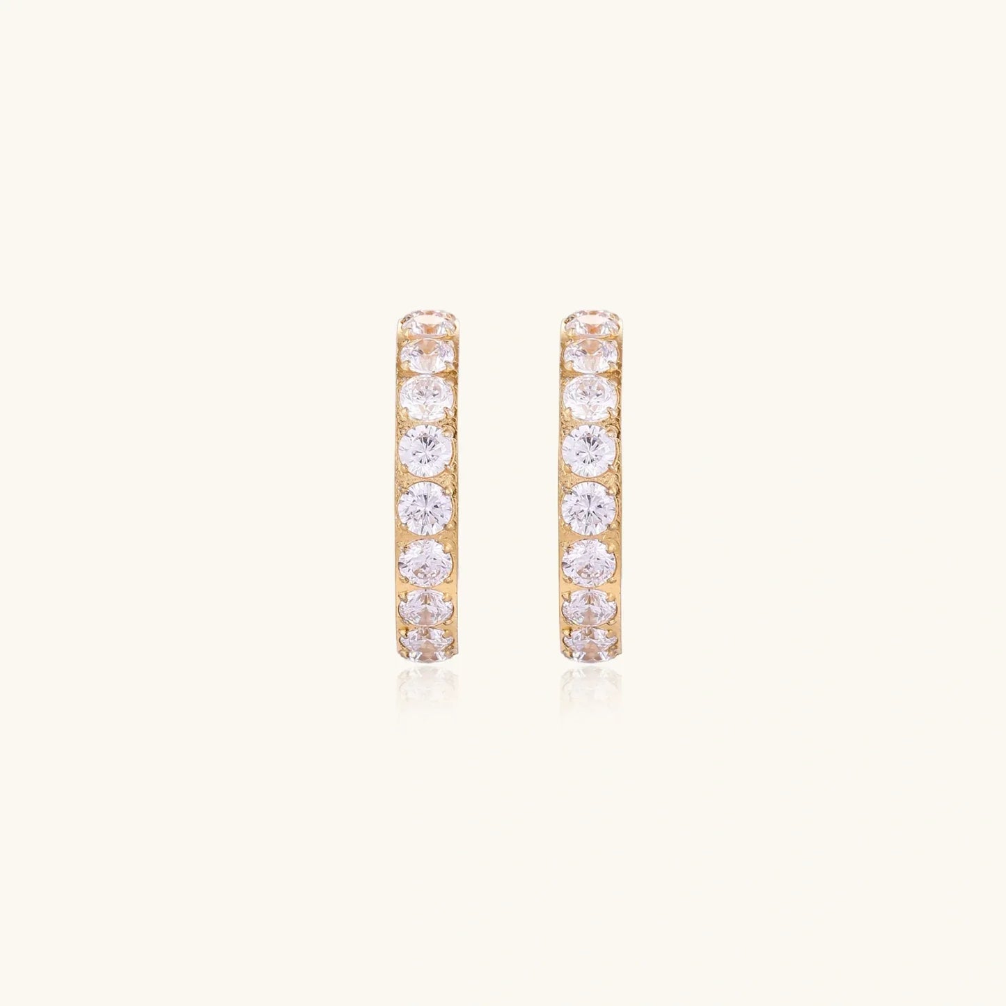 Gold pavé hoop earrings with two freshwater pearls nestled inside the curved design, featuring crystal-studded outer edge.