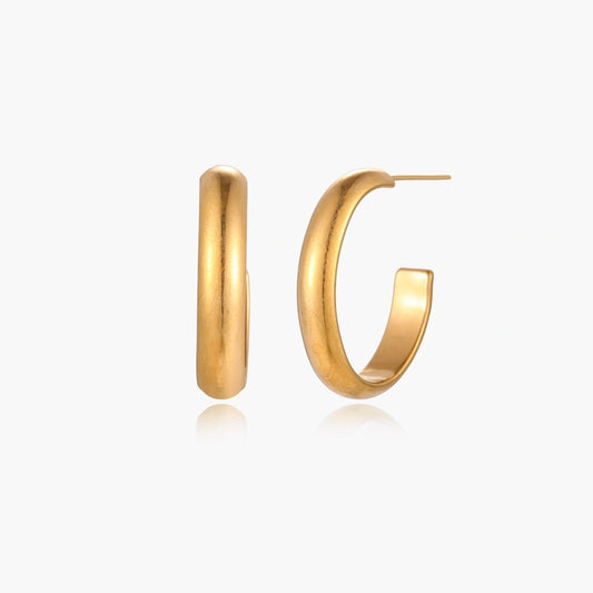 Smooth gold hoop earrings with a polished finish, exuding elegance and sophistication. Perfect for any occasion.