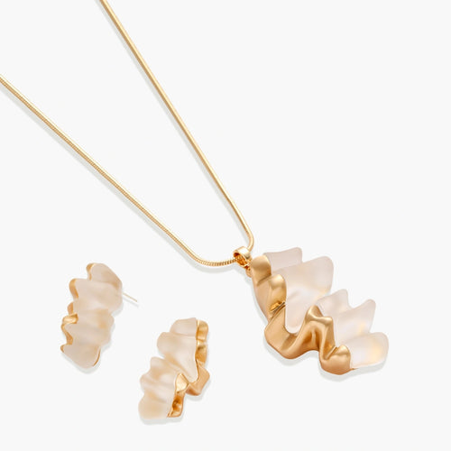 Sculptural gold-toned jewelry set featuring wavy organic earrings and matching necklace pendant with translucent resin accents.