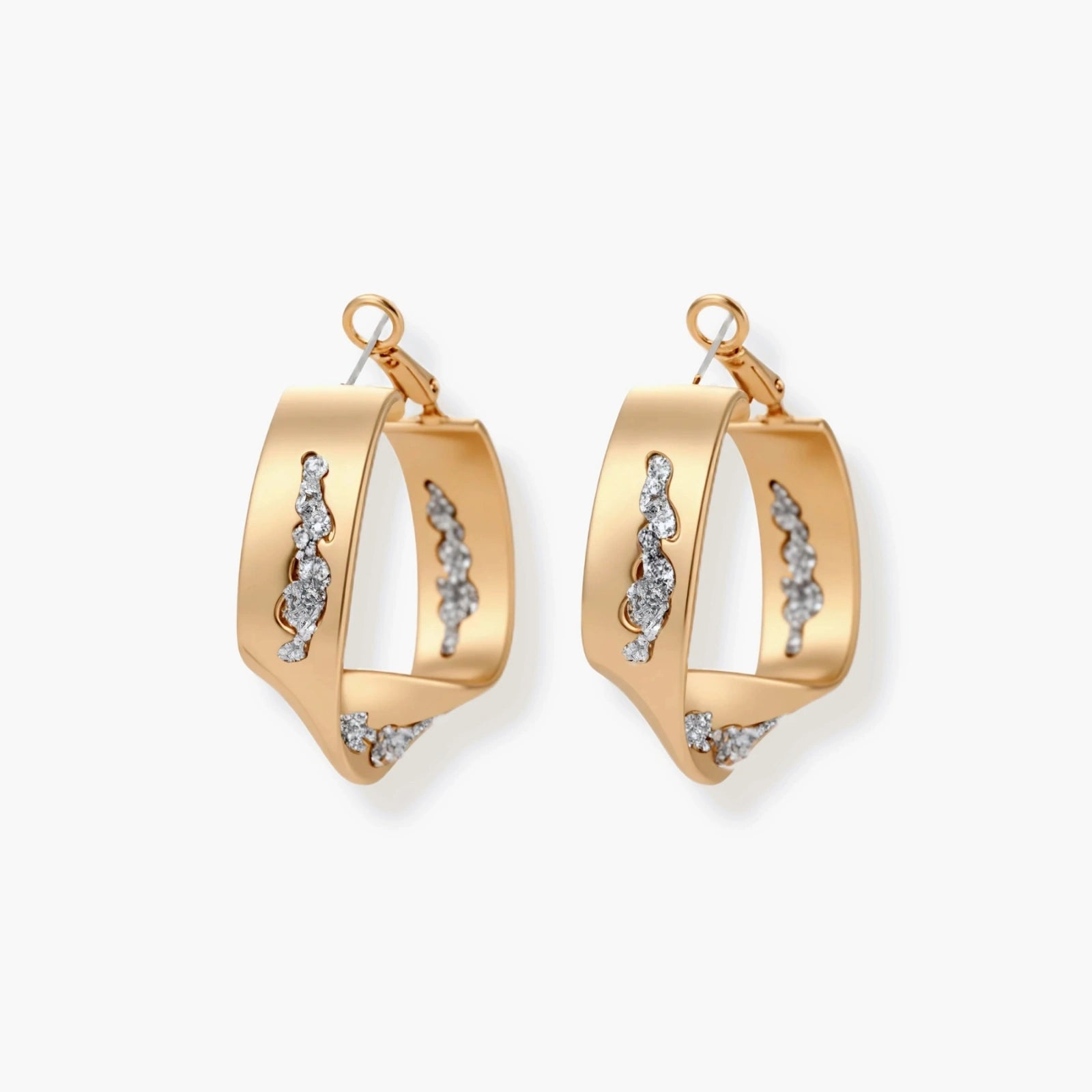 Sculptural wavy hoop earrings with crystal details and organic curved silhouette in gold and silver variants