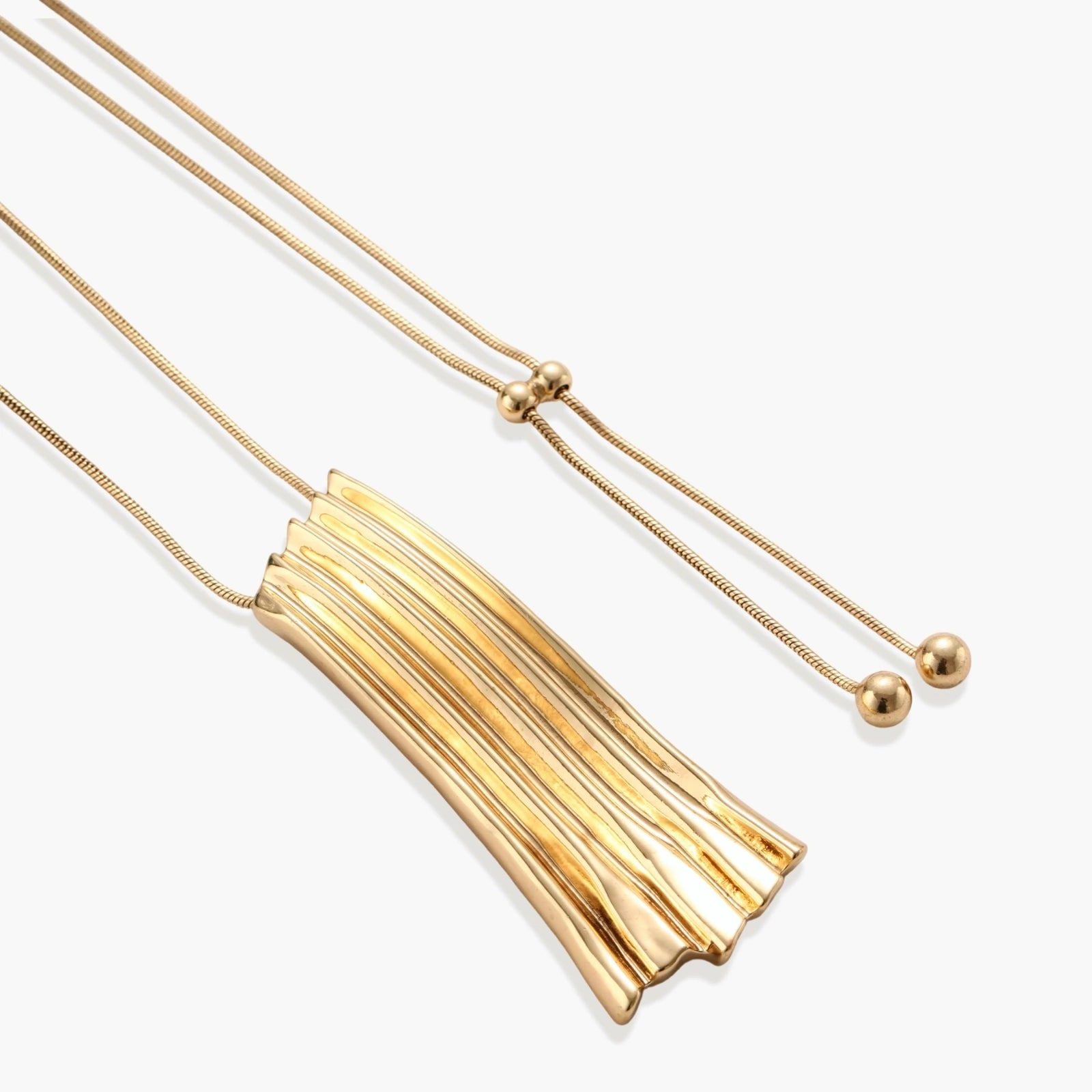 Modern adjustable necklace featuring geometric ribbed pendant with vertical lines in gold and silver finish options.