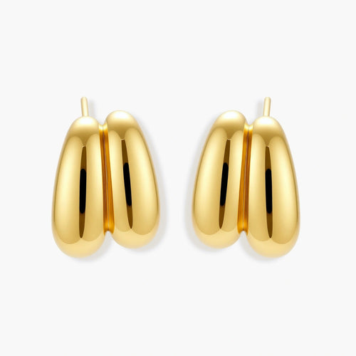Chunky 18K gold-plated sterling silver hoop earrings with flowing sculptural curves on white background.