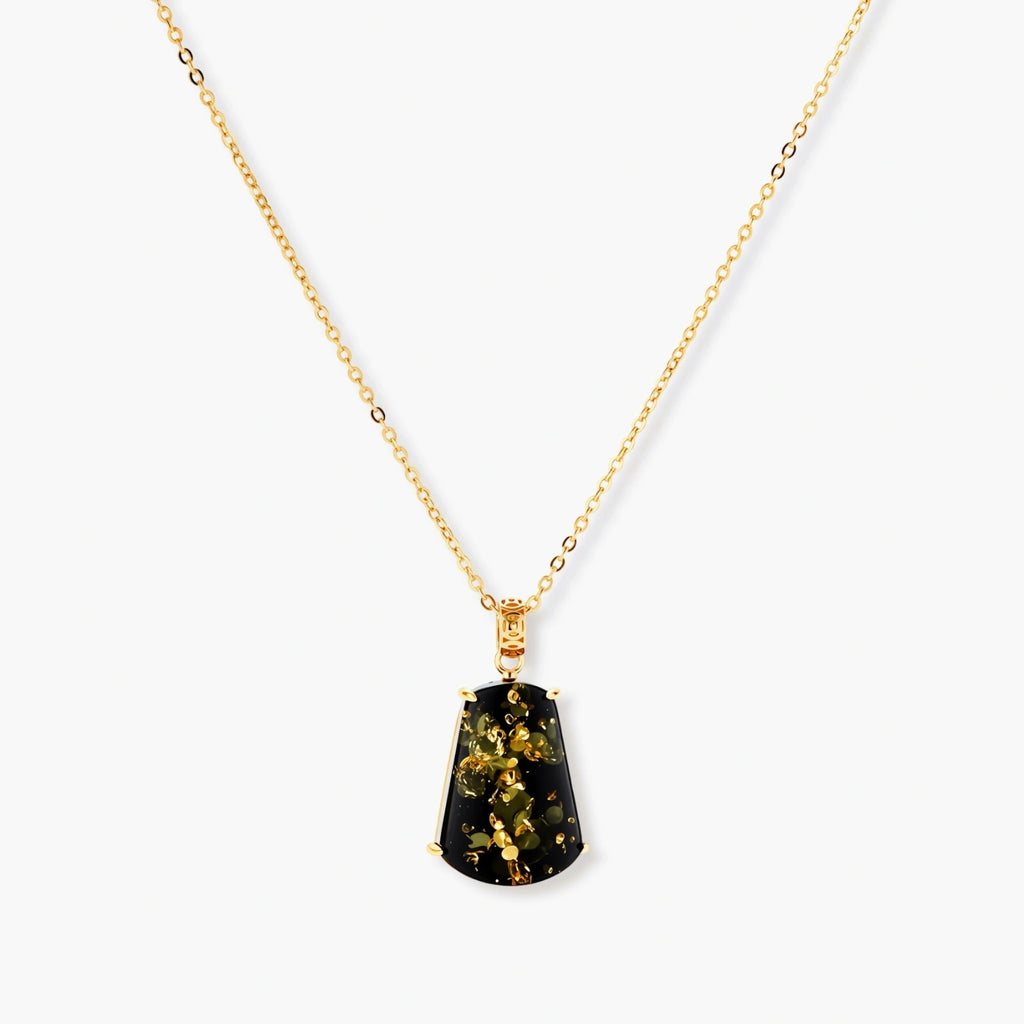 18k gold-plated necklace and earrings with green amber pendants featuring golden inclusions on cream background