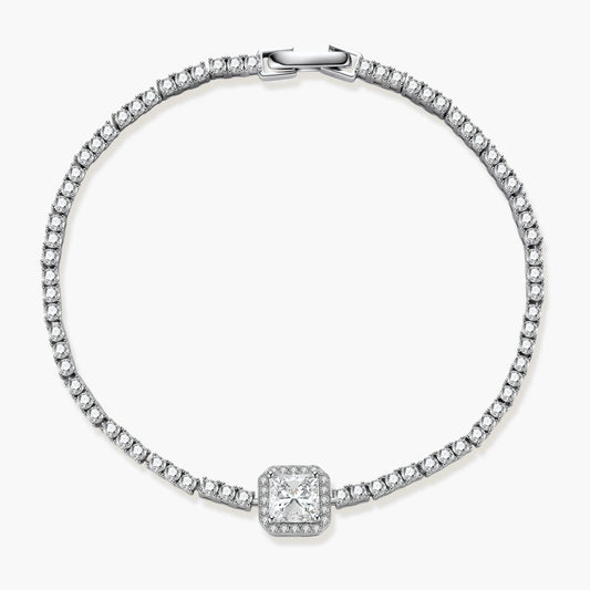 Sterling silver tennis bracelet with cushion-cut moissanite centerpiece surrounded by smaller stones in continuous setting