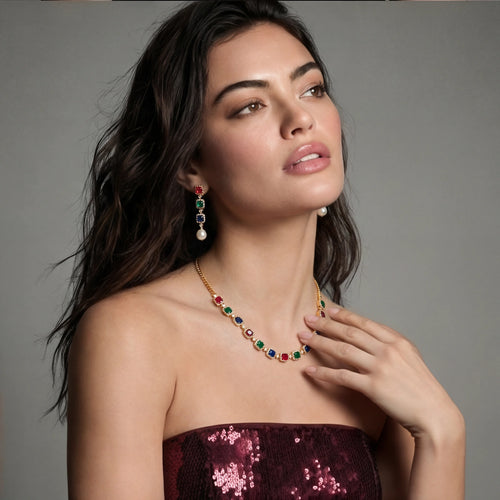 Model showcasing the Jewel Royalty Set, featuring radiant ruby, emerald, and sapphire stones in a stunning gold-plated design.