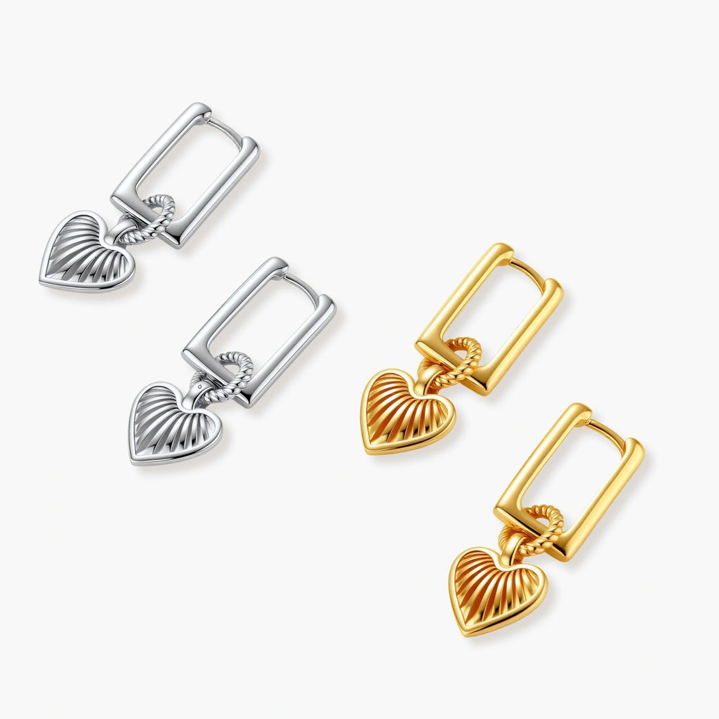 Platinum-plated 925 sterling silver rectangular hoop earrings with twisted ring connector and ribbed heart charm pendant.