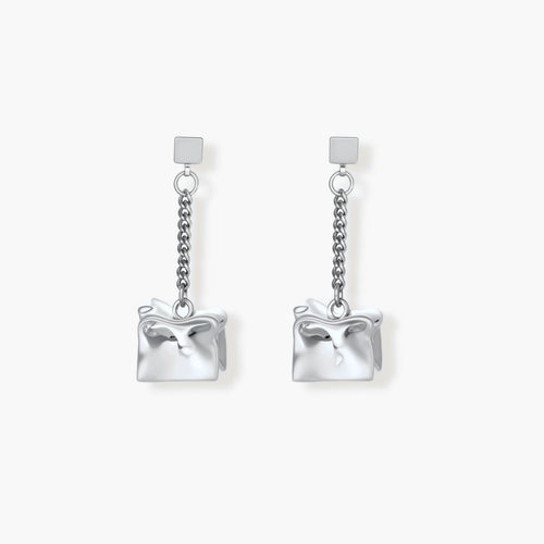 Modern silver dangle earrings with geometric cube pendants and chain design on minimalist background.