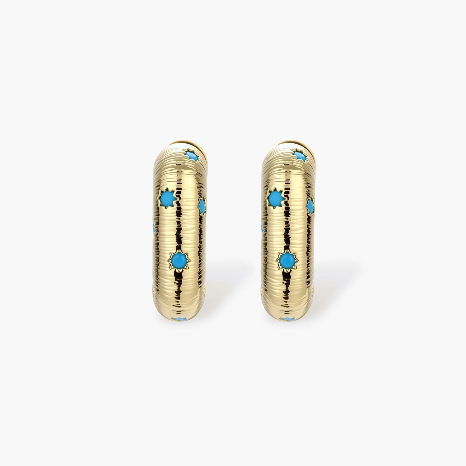 Gold-plated huggie hoop earrings with blue star inlays and textured surface, shown against white background.