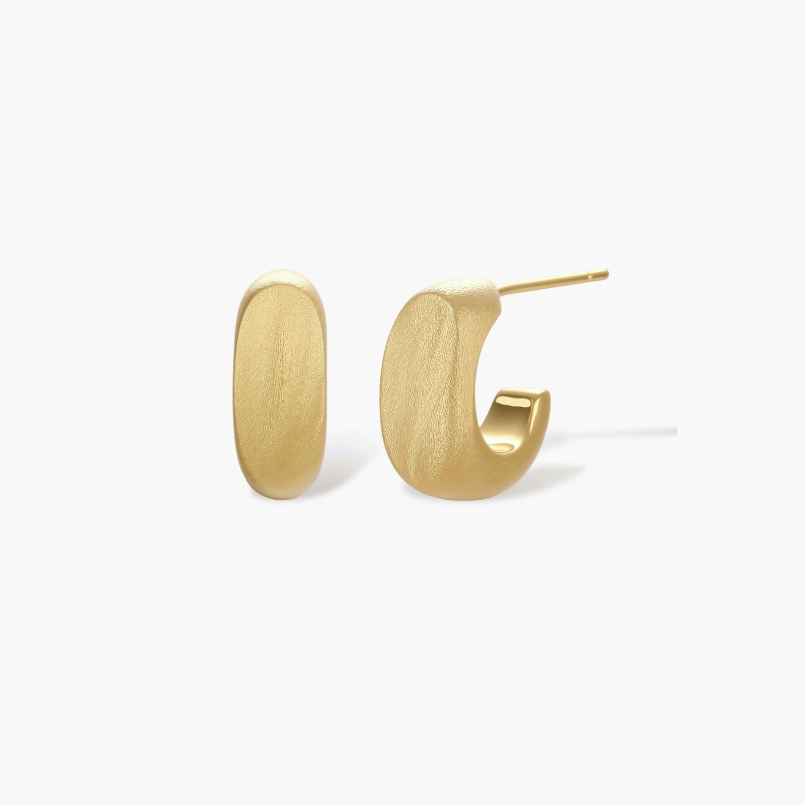 Small gold huggie earrings with matte finish, 14mm diameter, shown against cream background for everyday elegance.