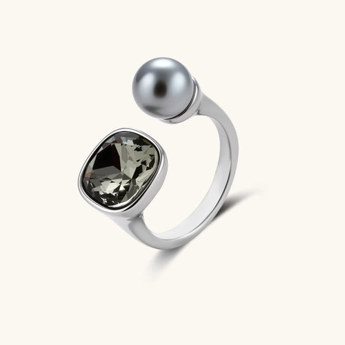 Modern adjustable ring featuring a cushion-shaped smoky zircon stone and a sleek metallic sphere in a platinum-plated finish.
