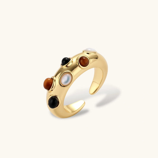 Domed gold band featuring six vibrant cabochons in an organic bubble design, showcasing elegance and sophistication.