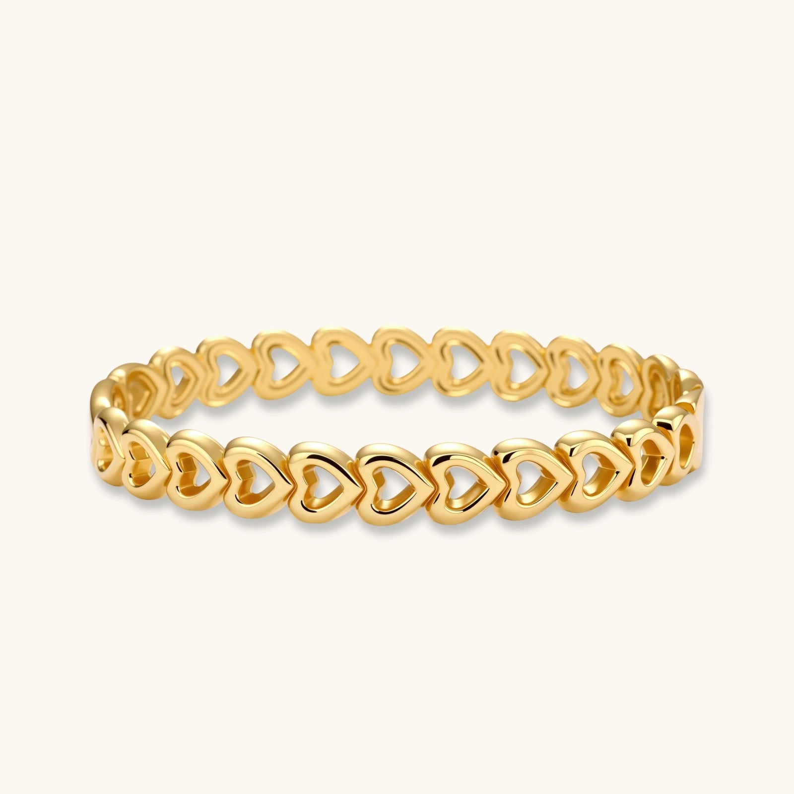 Gold bangle featuring elegantly linked open heart shapes with a polished finish, exuding sophistication and romance.