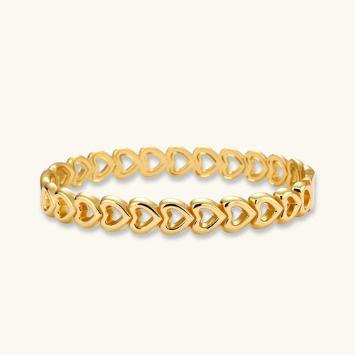 Gold bangle featuring elegantly linked open heart shapes with a polished finish, exuding sophistication and romance.