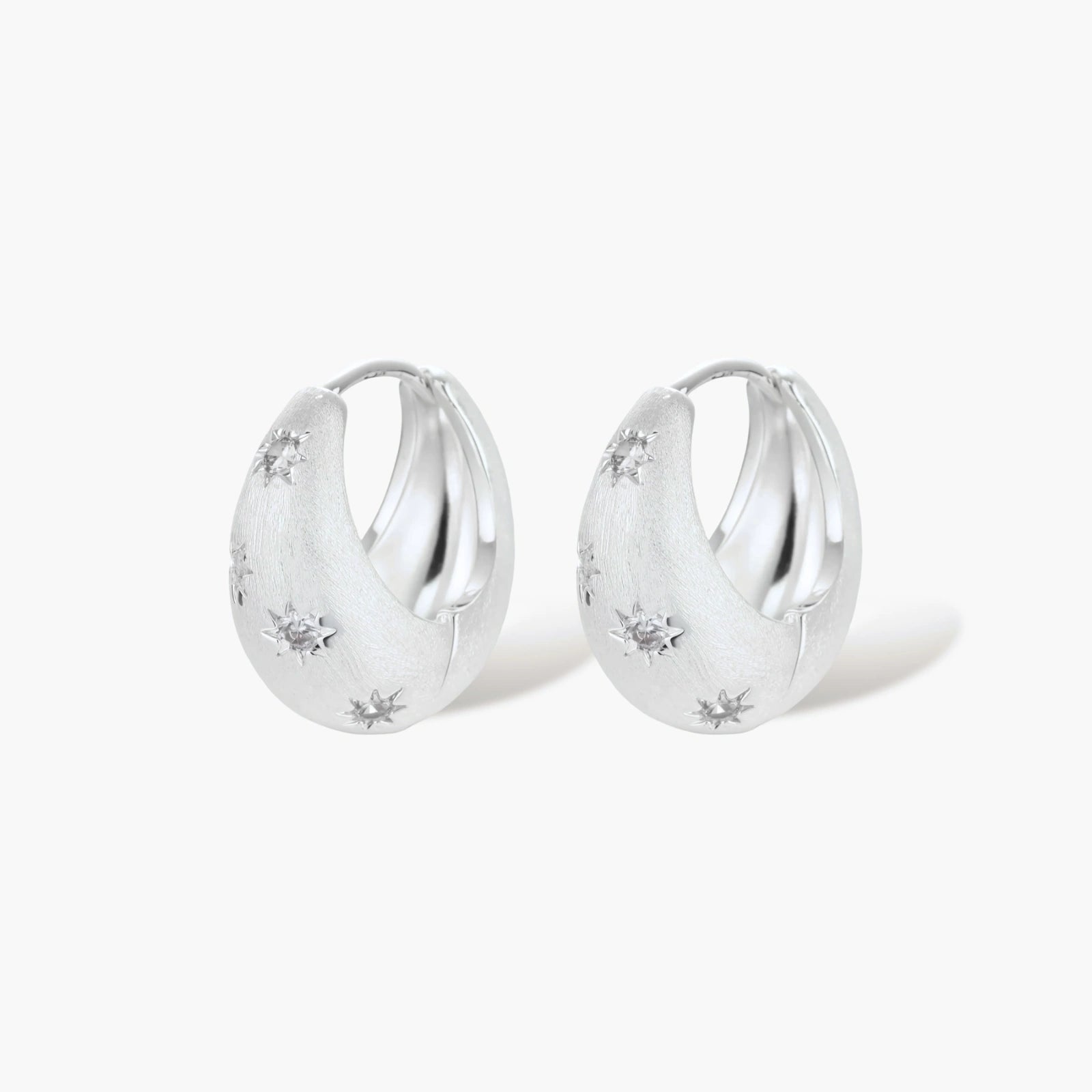 Silver-plated hoop earrings with star cutout designs, shown open and closed on white background, 17mm diameter.