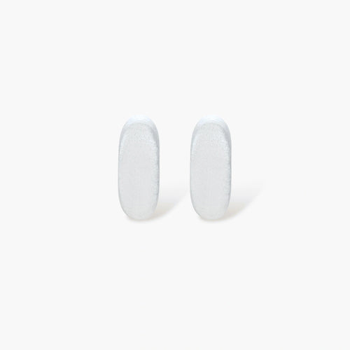 Pair of small silver-plated huggie hoop earrings with clean minimal design on neutral background.