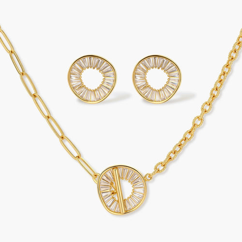 Gold-plated necklace and earring set with circular CZ crystal pendants featuring radial design on cream background