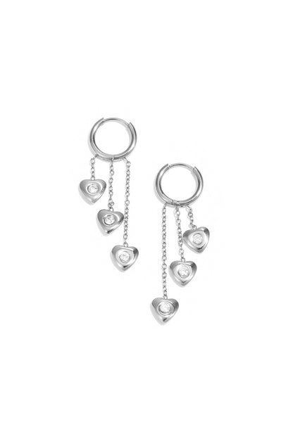 Earrings with dangling hearts at different heights