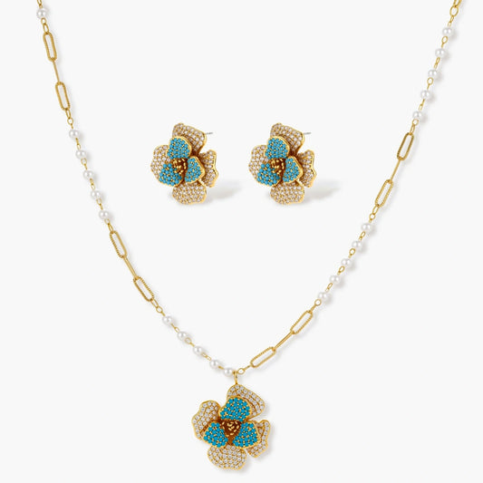 Flower-shaped earrings and pendant necklace featuring turquoise petals, elegantly designed in a luxurious jewellery set.