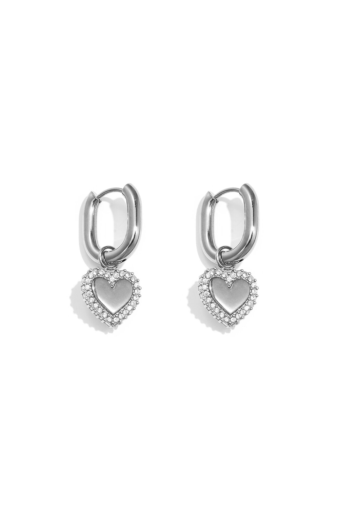 Squoval earrings with heart charms with set edges