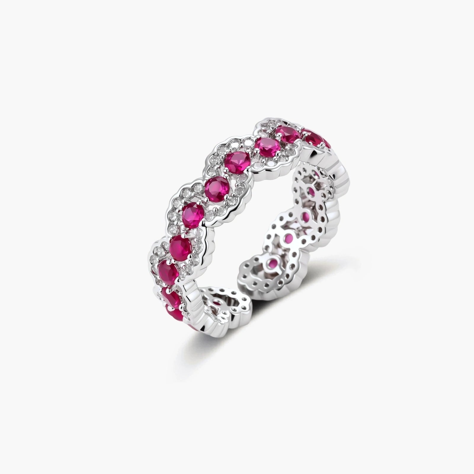 Ornate adjustable ring with pink cubic zirconia stones in white gold-plated copper setting with floral metalwork details