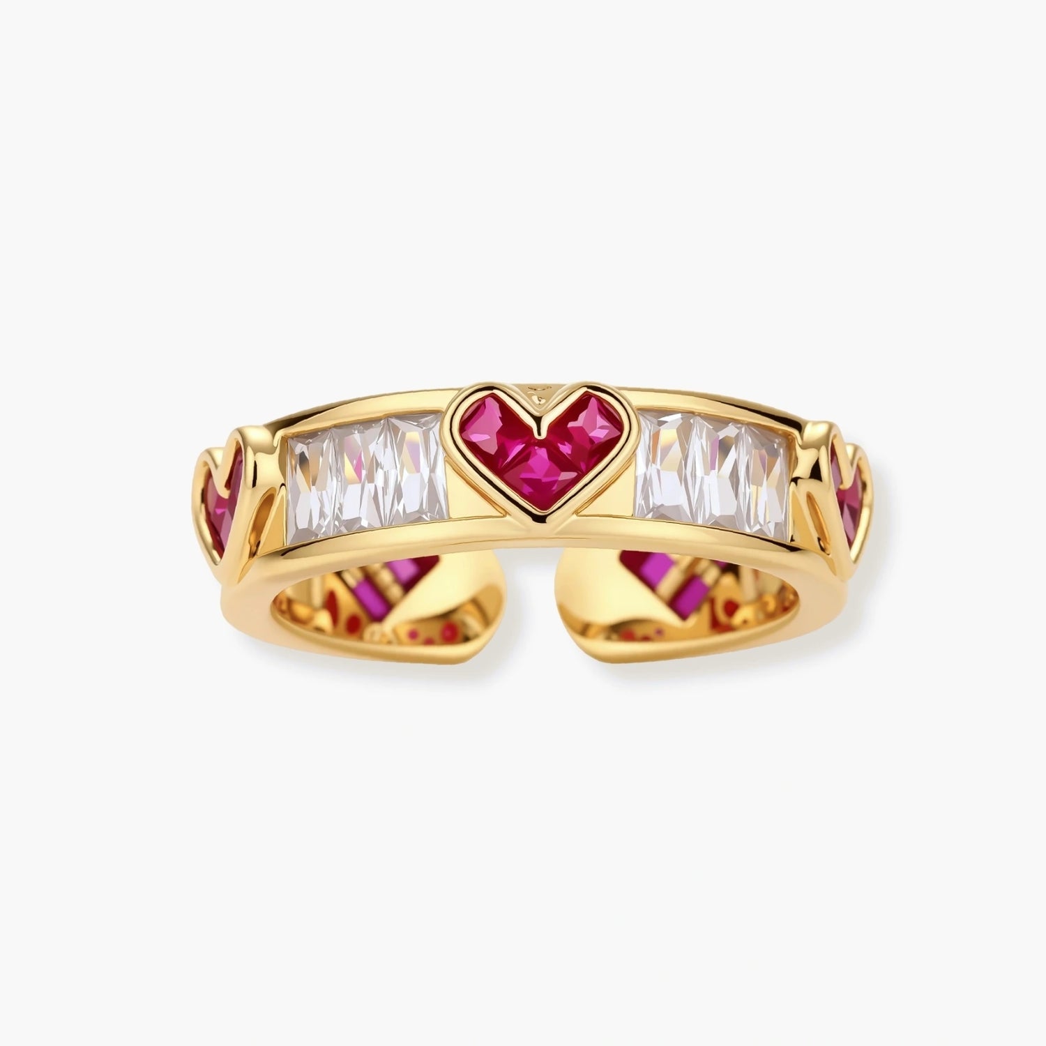 Gold-plated adjustable ring featuring pink heart-shaped and clear baguette stones in a geometric design.