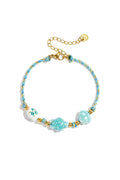 Bracelet with tortoise and shell beads and rope motif
