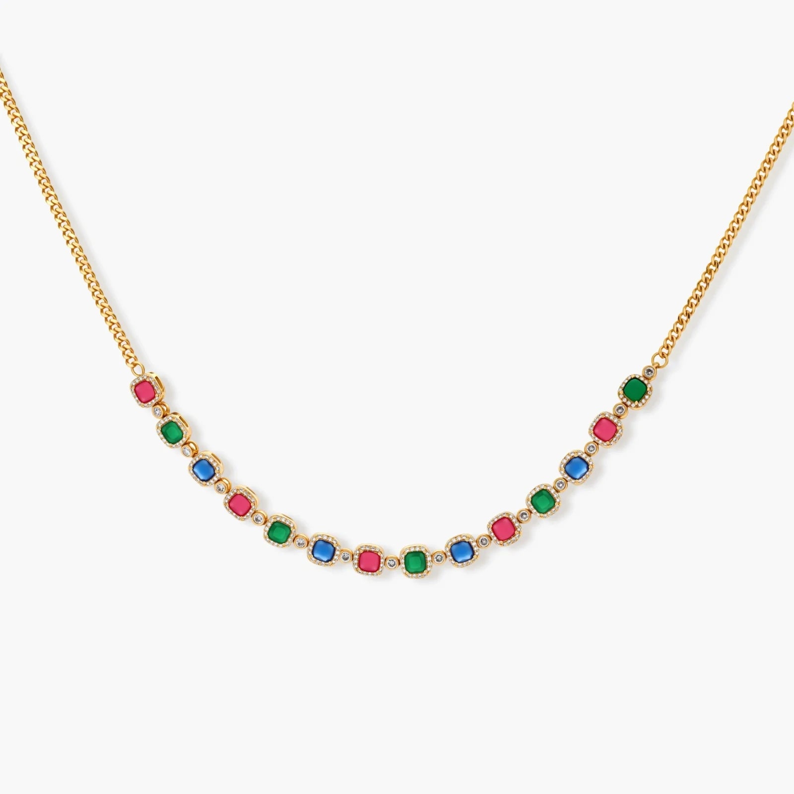 Gold-plated jewelry set with red, green, and blue cubic zirconia stones including necklace, bracelet, and drop earrings.