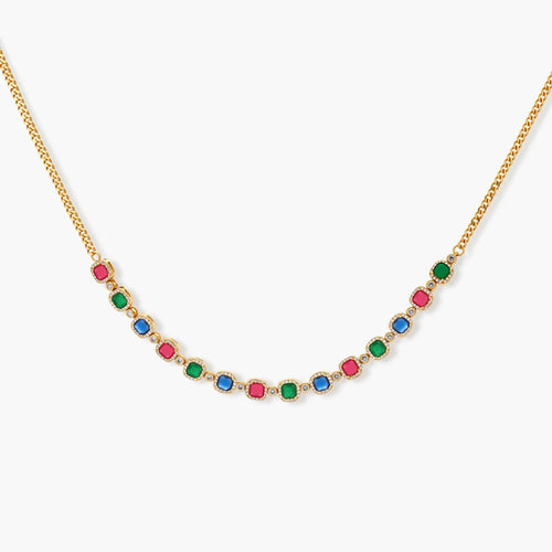 Gold-plated jewelry set with red, green, and blue cubic zirconia stones including necklace, bracelet, and drop earrings.
