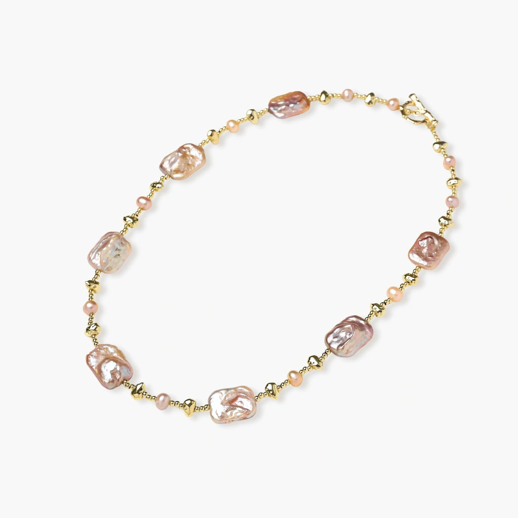 Iridescent baroque pearls alternating with small freshwater pearls on 14K gold-plated chain