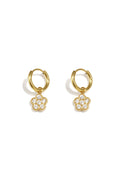 Small hoop earrings with hanging flowers made of zirconia stones