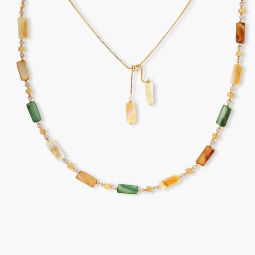 Adjustable necklace featuring an elegant arrangement of green, amber, and cream shell beads with gold accents.